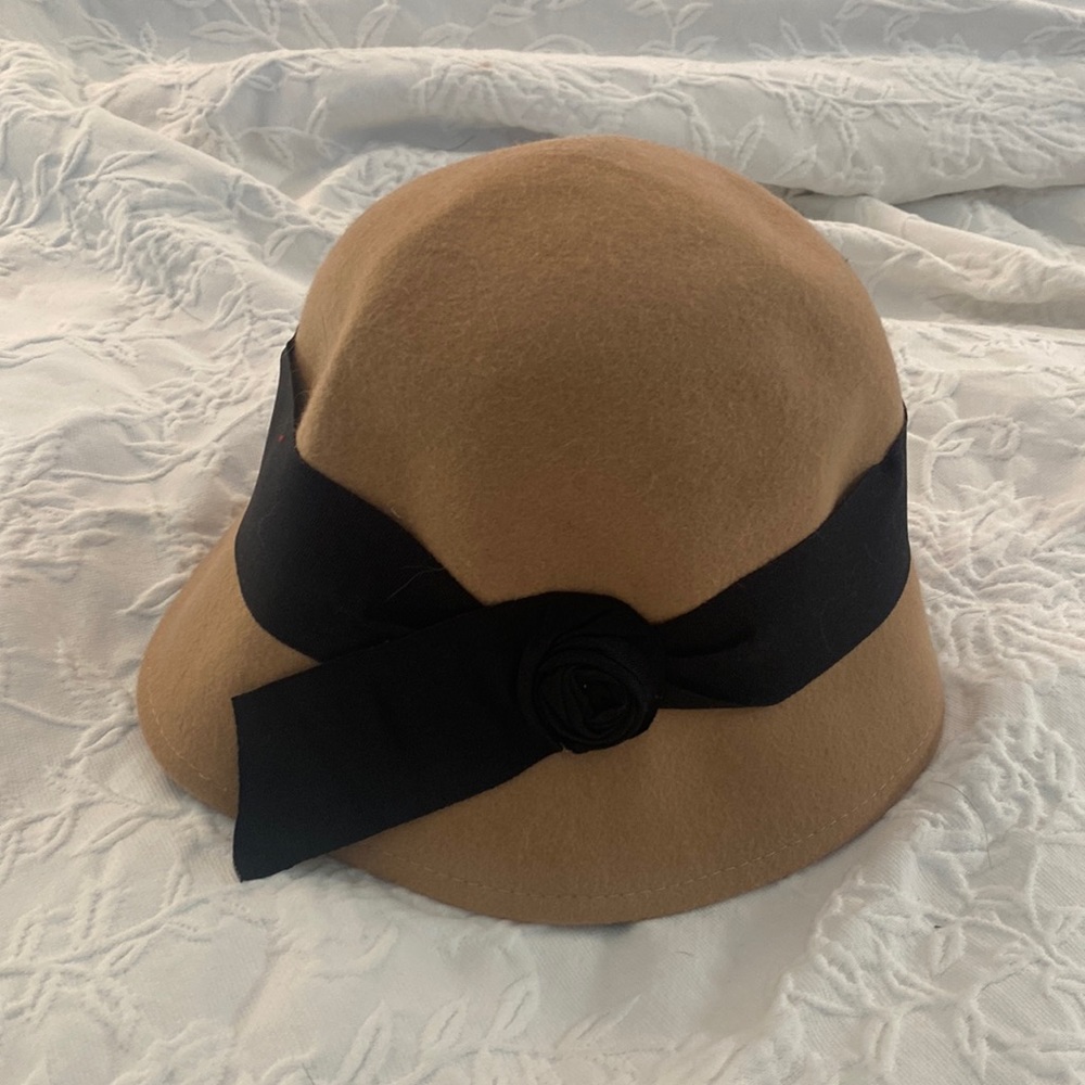 Tan with black bow hat